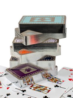 Stack of silver gilt playing cards packs
