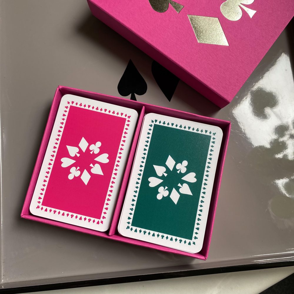 Fuchsia sleeve box with pink & dark green playing cards