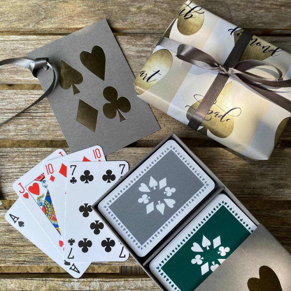 Grey sleeve box with grey and dark green playing card set