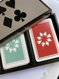 lacquered bamboo box containing twin pack of playing cards in jade and red