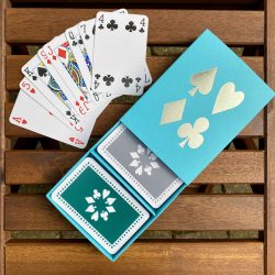 Turquoise sleeve box with green & grey playing cards