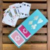 Turquoise sleeved box with pink & pale pink playing cards